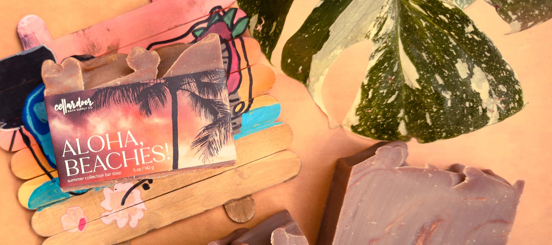 Bar soap with 'Aloha Beaches!' text and palm trees on a colorful background