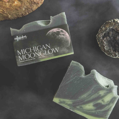 Bar of soap with 'Michigan Moonglow' packaging on a dark background