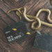 Sex Machine bar soap with a snake on a wooden surface