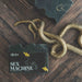 Soap bar labeled 'Sex Machine' with a snake on a wooden surface